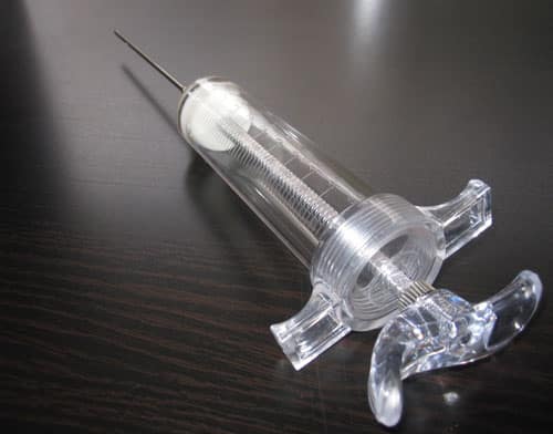 empty syringe for dermal fillers on the table