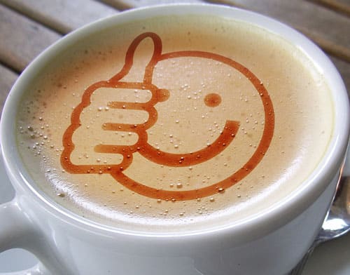 cappuccino cup with emoji on the foam