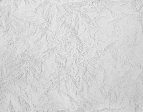 a sheet of slightly crumpled gray paper