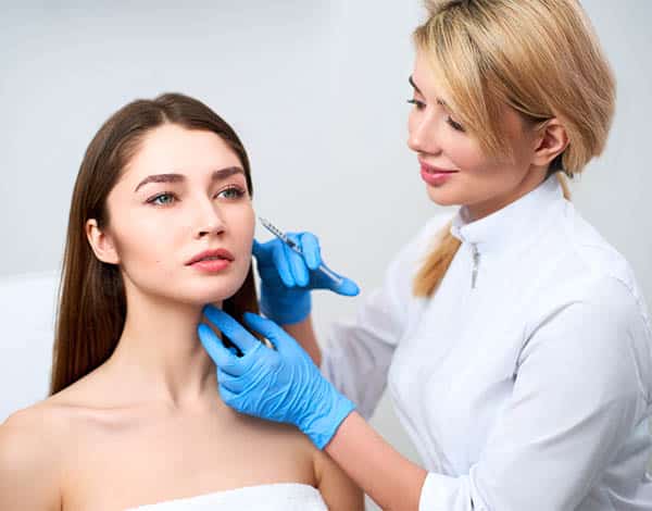 The doctor demonstrates filler injection with decreased discomfort and bruising
