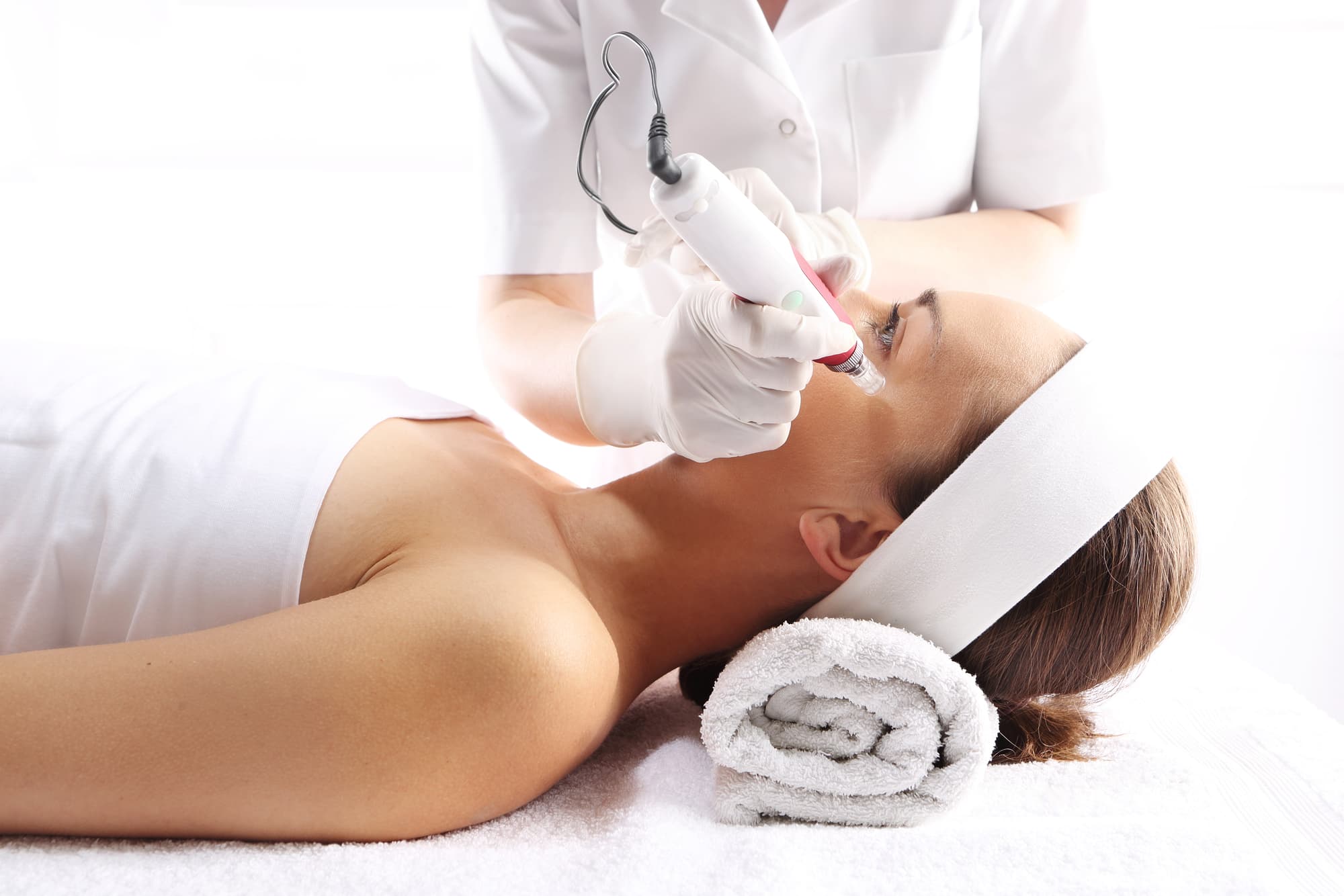 a woman receives a mesotherapy procedure on her face