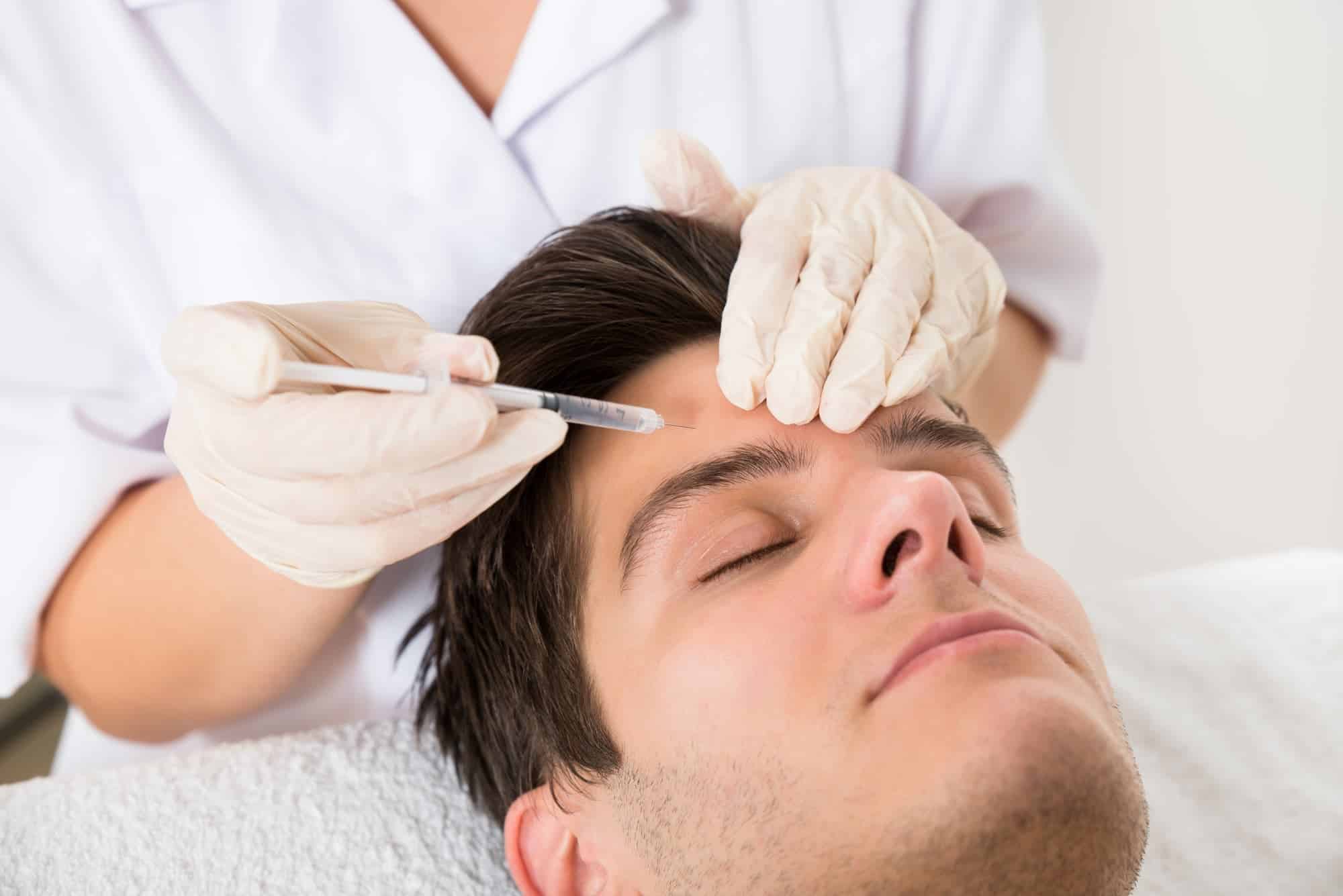man getting a forehead treatment