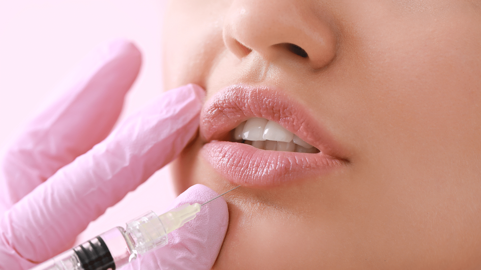 Close-up of client receiving a lip injection.