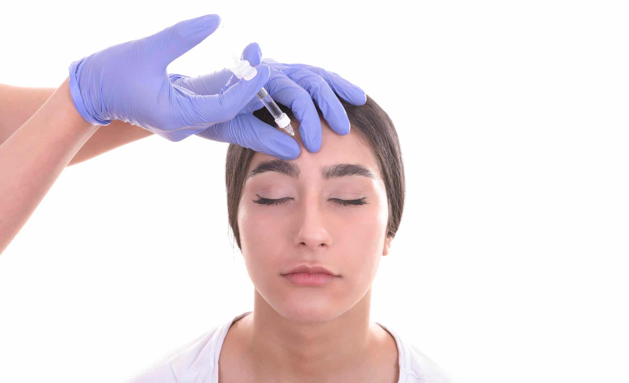 A patient receives Dysport treatment to relieve headaches.