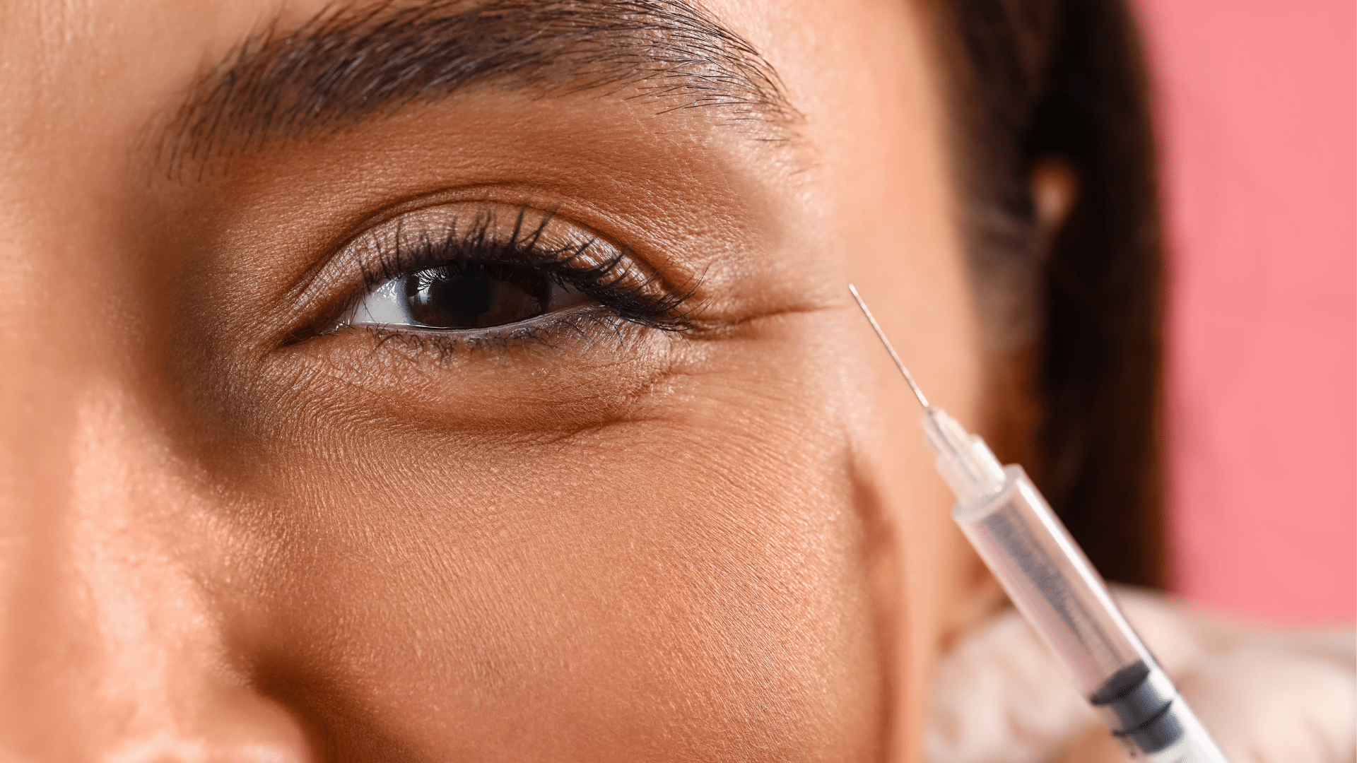 Woman getting eye injection.