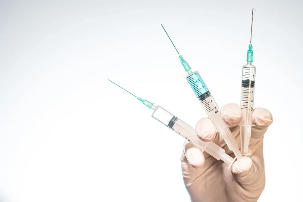syringes in the doctor's hand contains the gel