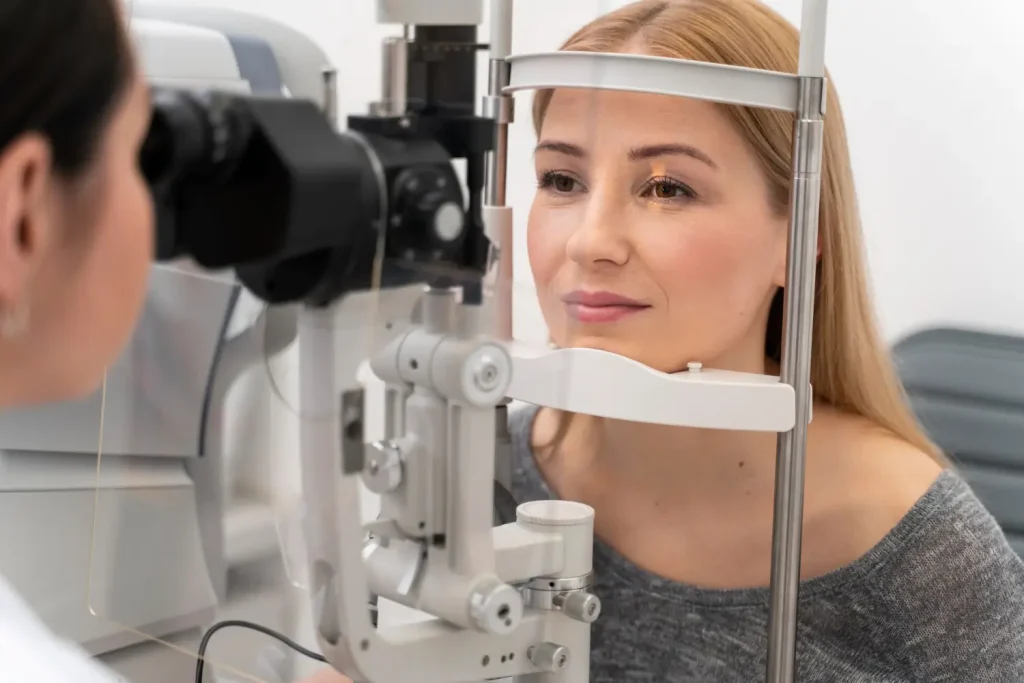 checking her eye for its condition