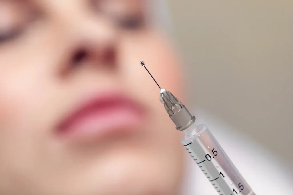 preparing the syringe and ready to inject