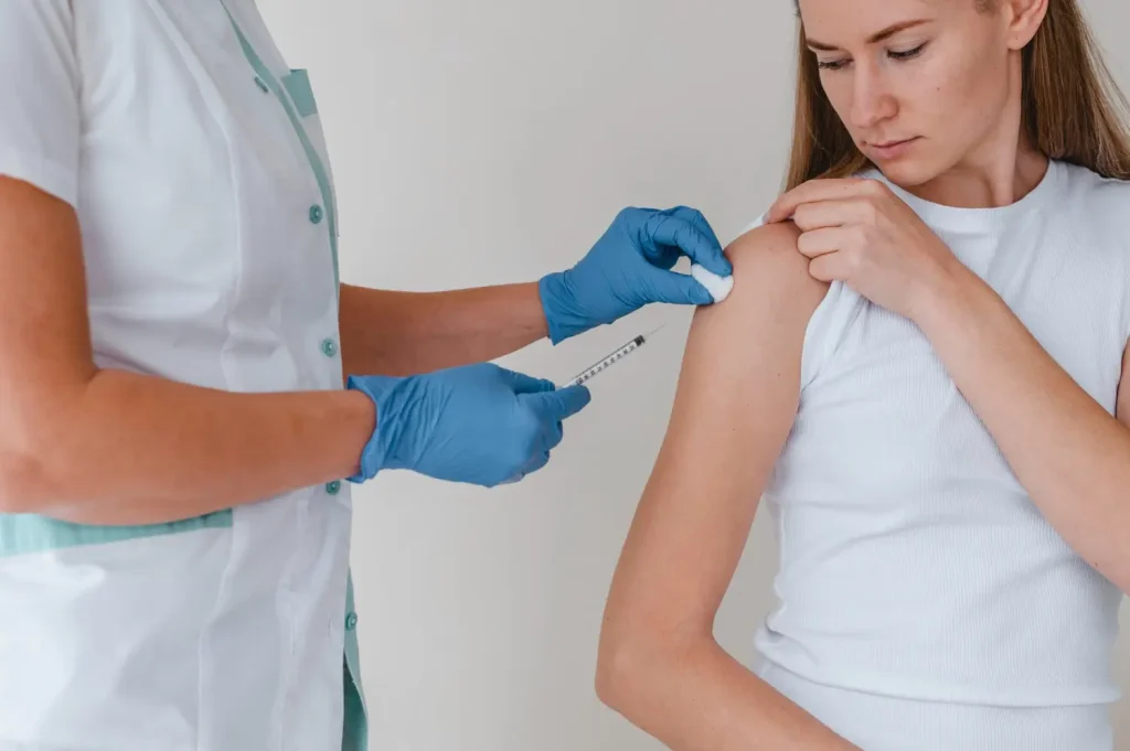 patient gets an injection for the arm
