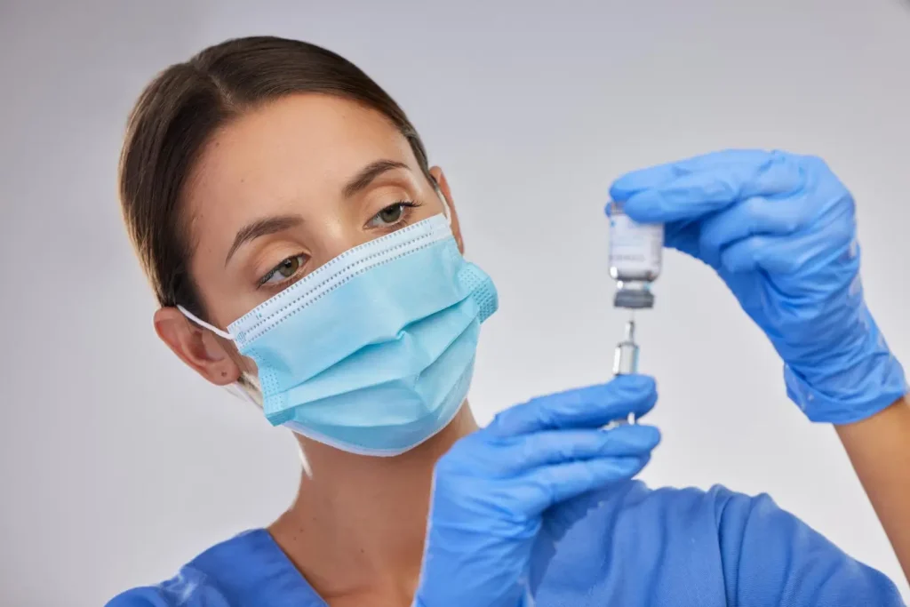 medical professional prepares the injection