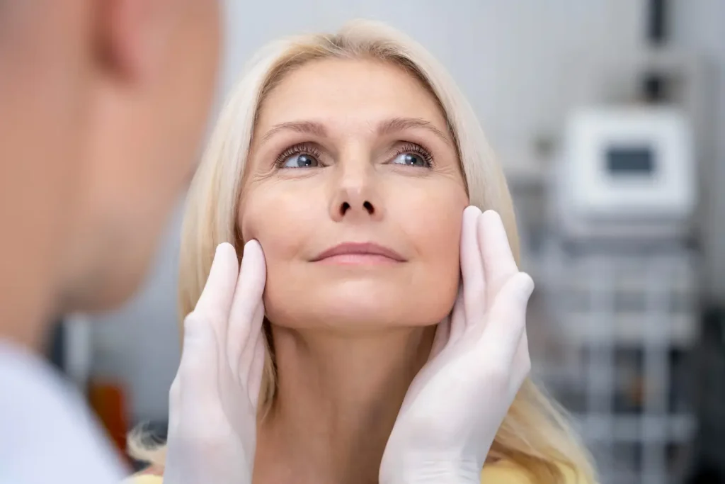 patient comfortably lets the derma check on her face