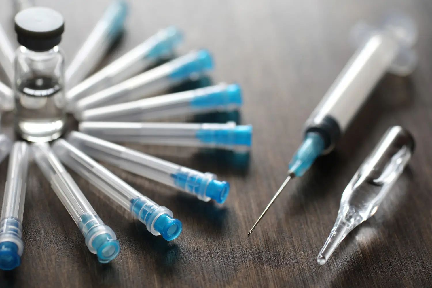 the vials and syringes on the table