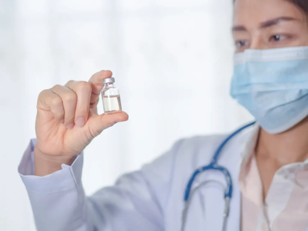 doctor presenting the new treatment in a vial