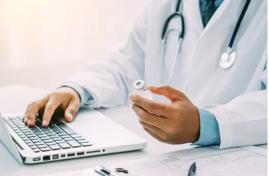 doctor checking the label and ingredients of the treatment