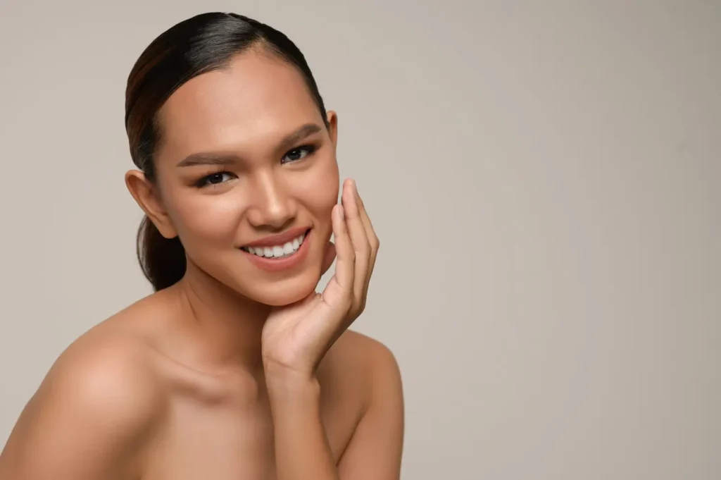 she is smiling happily for her rejuvenated skin