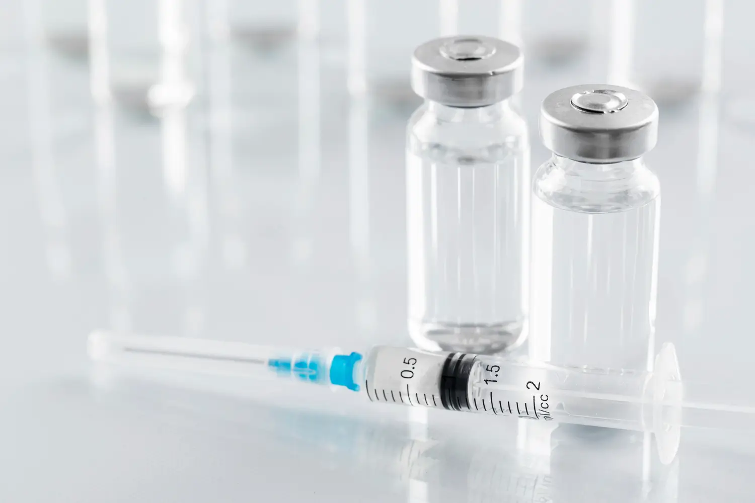 vials and syringe on the table