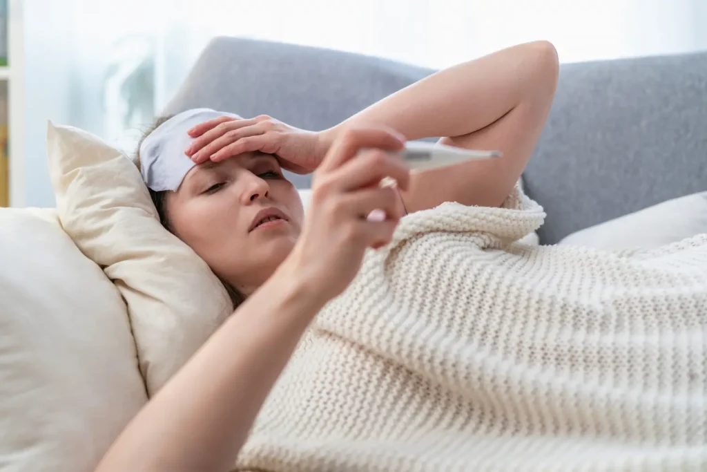 feeling sick and having a headache while lying in bed