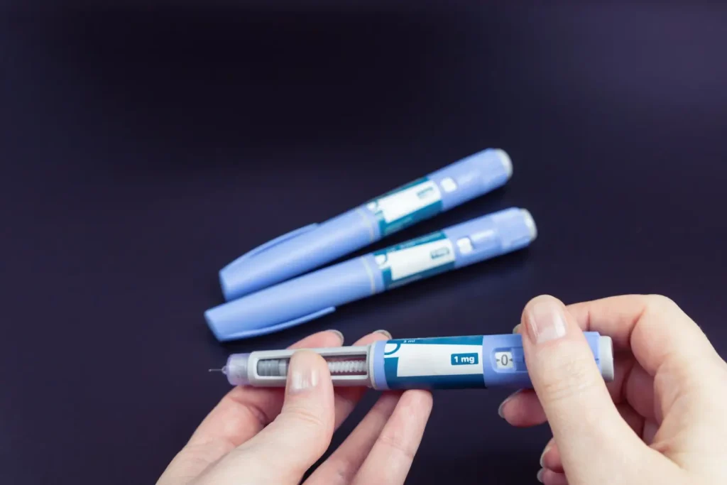 the treatment pen that she injects on herself