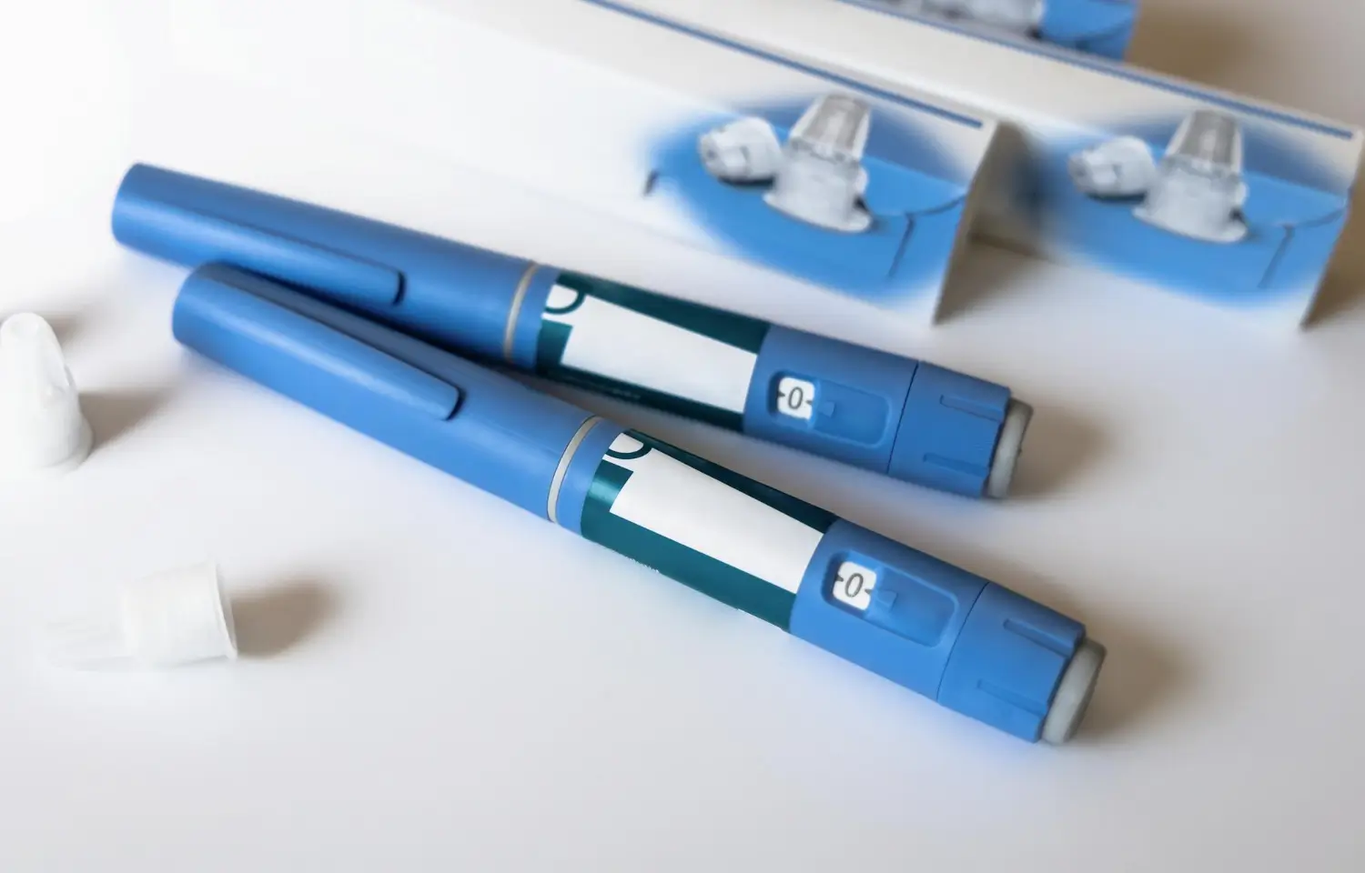 two pens for injecting the medication on the patient