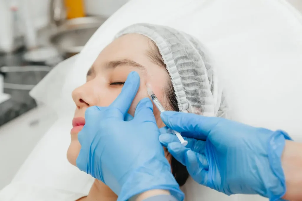 injecting the treatment on the woman's face
