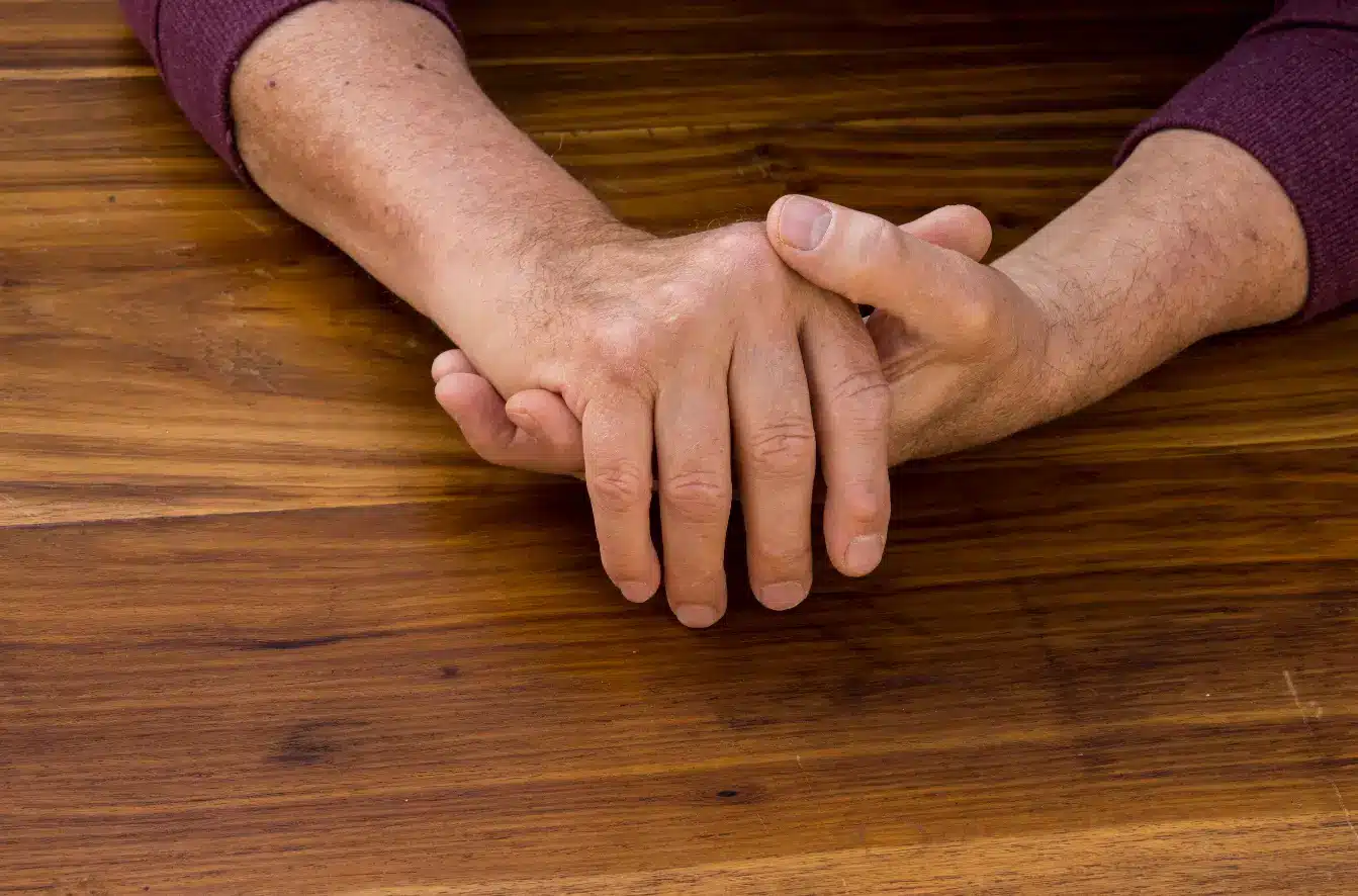Elderly person suffering from chronic diseases seeks medication like Cimzia for pain relief.